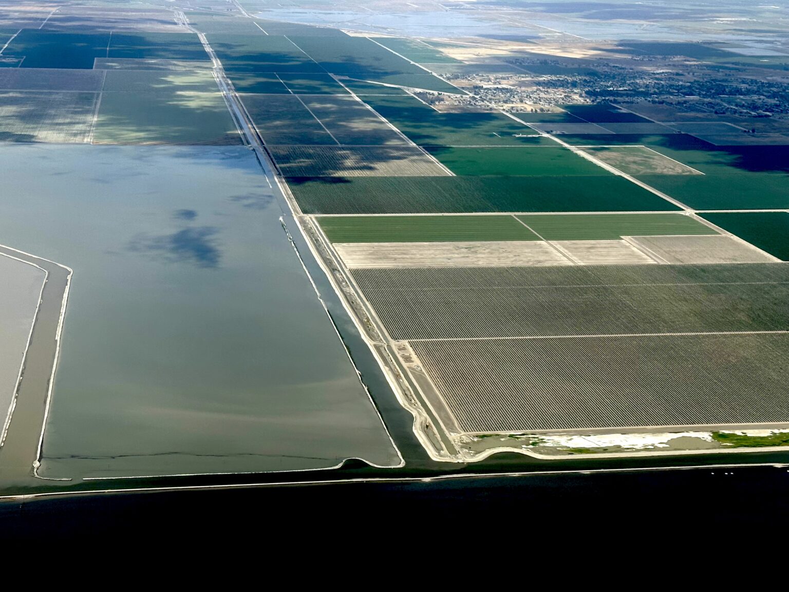 Corcoran is raising their levee, again. But the ground is sinking